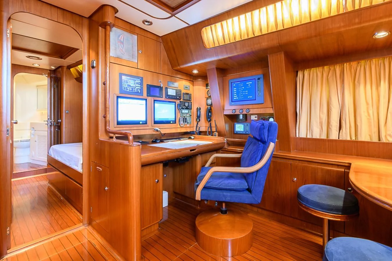 a room with a desk and chairs aboard CRYSTAL Yacht for Sale