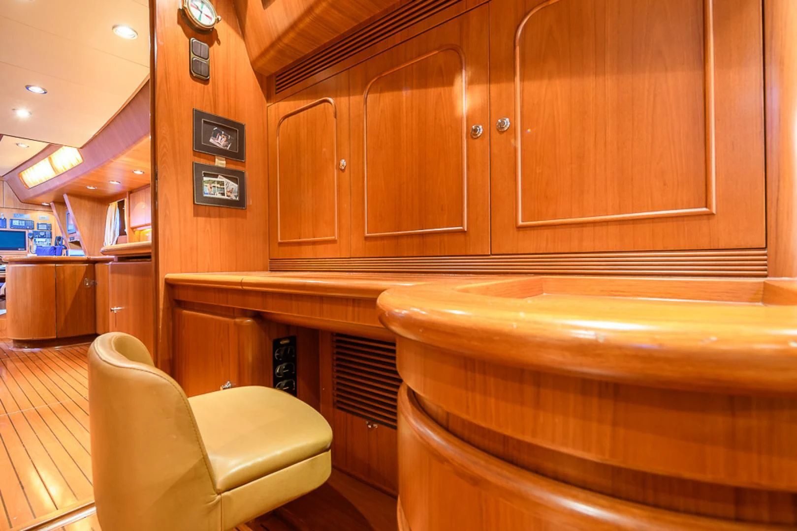 a kitchen with wooden cabinets aboard CRYSTAL Yacht for Sale