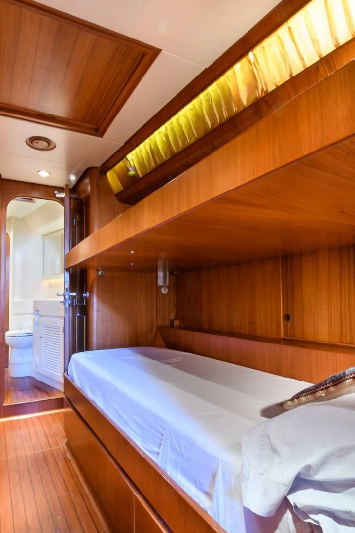 a bed in a room aboard CRYSTAL Yacht for Sale