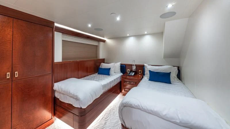 a room with two beds aboard BLUE TIME Yacht for Sale