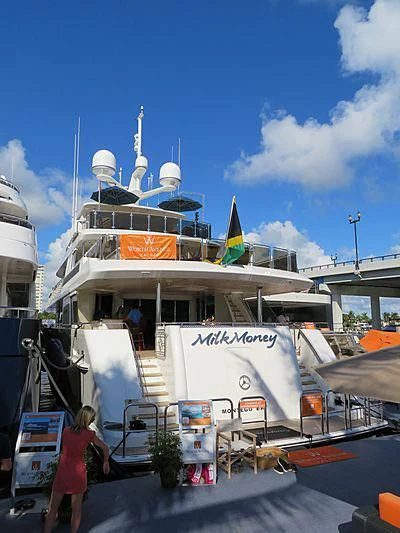 a large white boat with a blue roof aboard BLUE TIME Yacht for Sale
