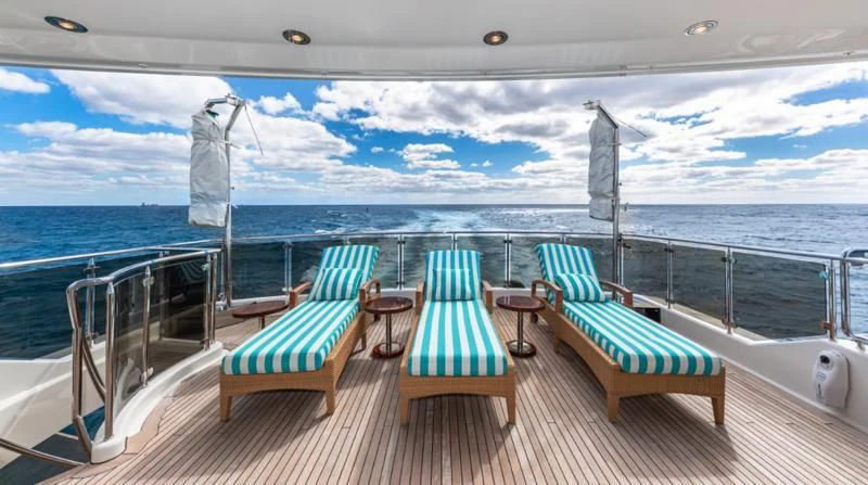 a deck with chairs on it aboard BLUE TIME Yacht for Sale