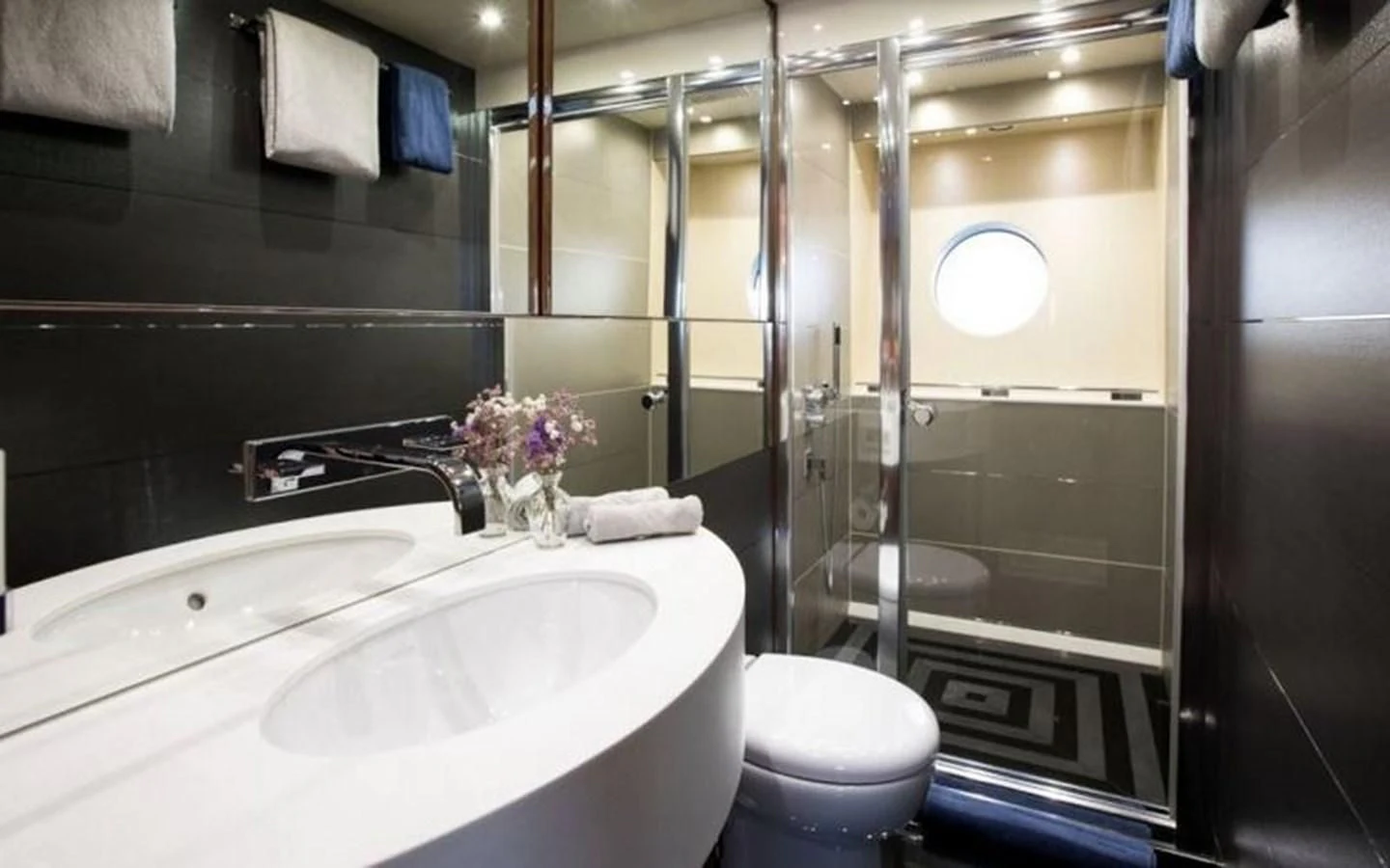 a bathroom with a sink toilet and bathtub aboard YINWA Yacht for Sale