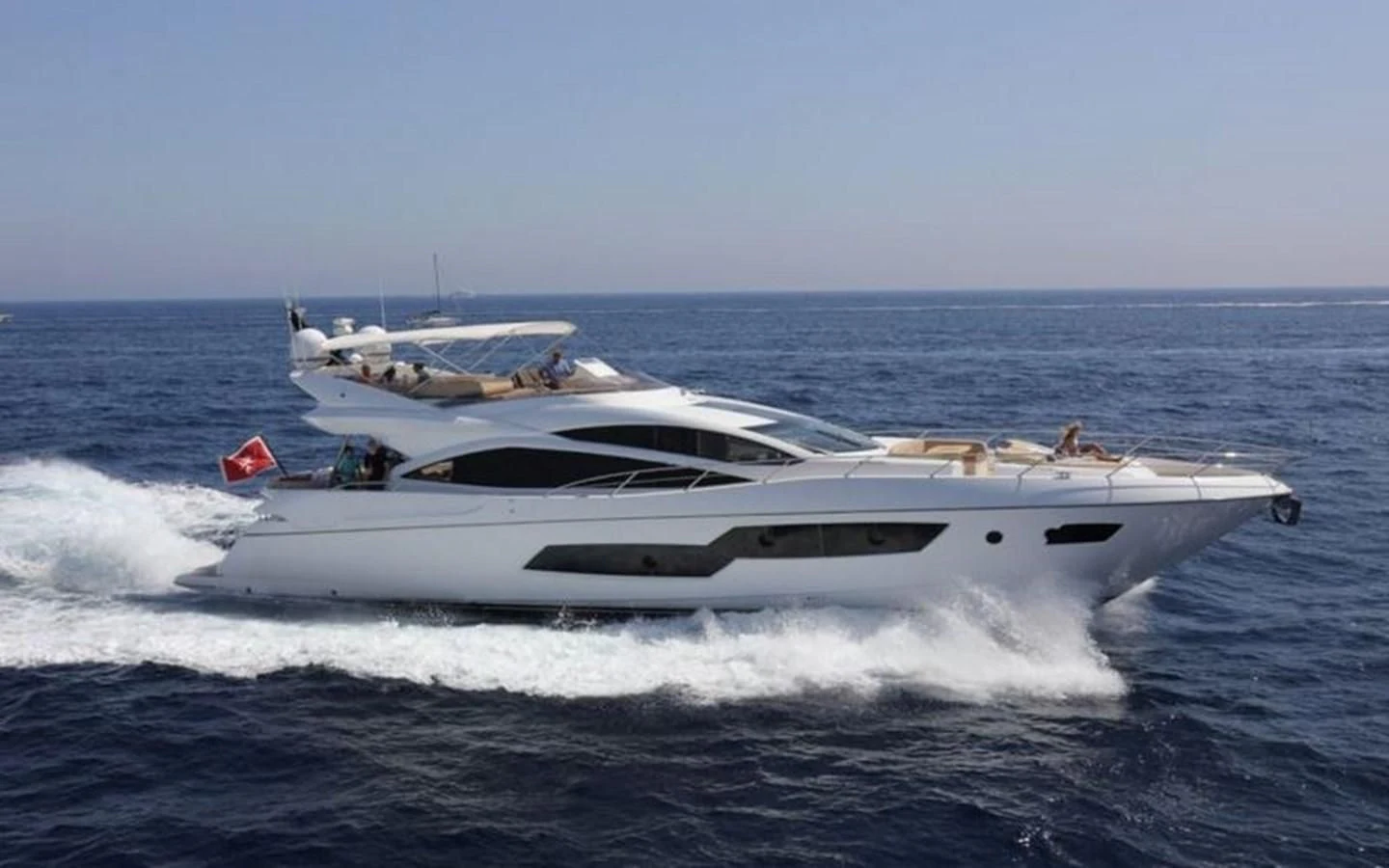 a white yacht on the water aboard YINWA Yacht for Sale