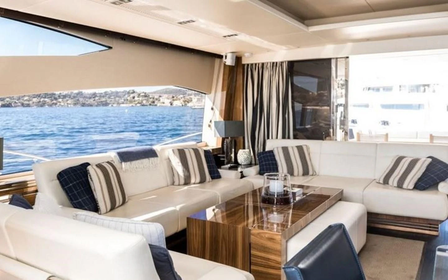 a living room with a large blue ocean aboard YINWA Yacht for Sale