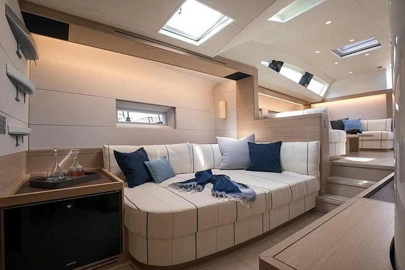 a room with a bed and a desk aboard KIBOKO TRES Yacht for Sale