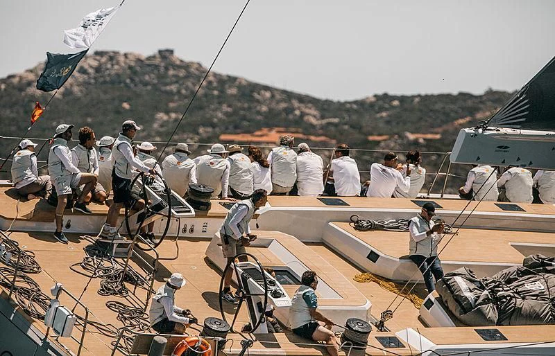 a group of people at a construction site aboard KIBOKO TRES Yacht for Sale
