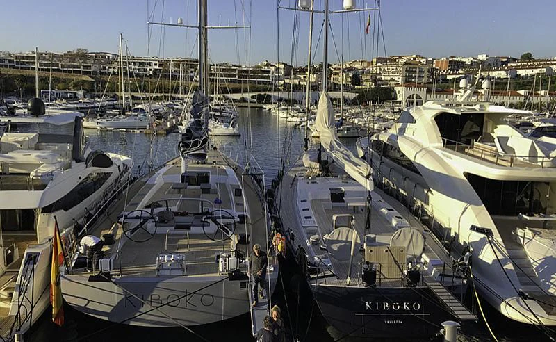a group of boats are parked in a harbor aboard KIBOKO TRES Yacht for Sale