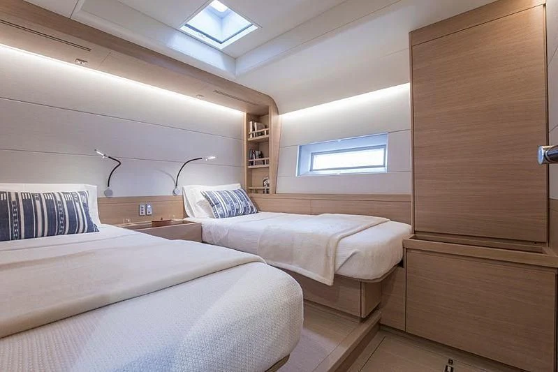a room with two beds aboard KIBOKO TRES Yacht for Sale