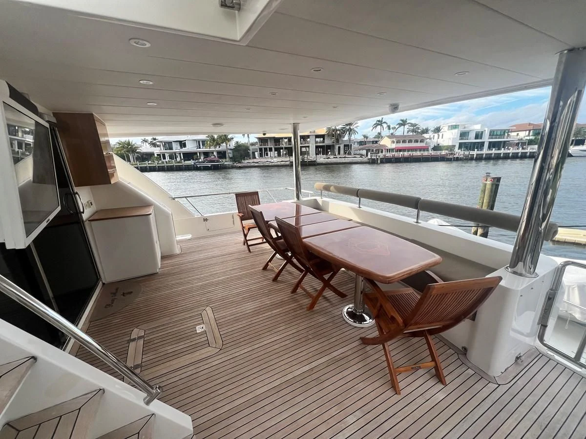 a room with a table and chairs aboard ROXY MARIA Yacht for Sale