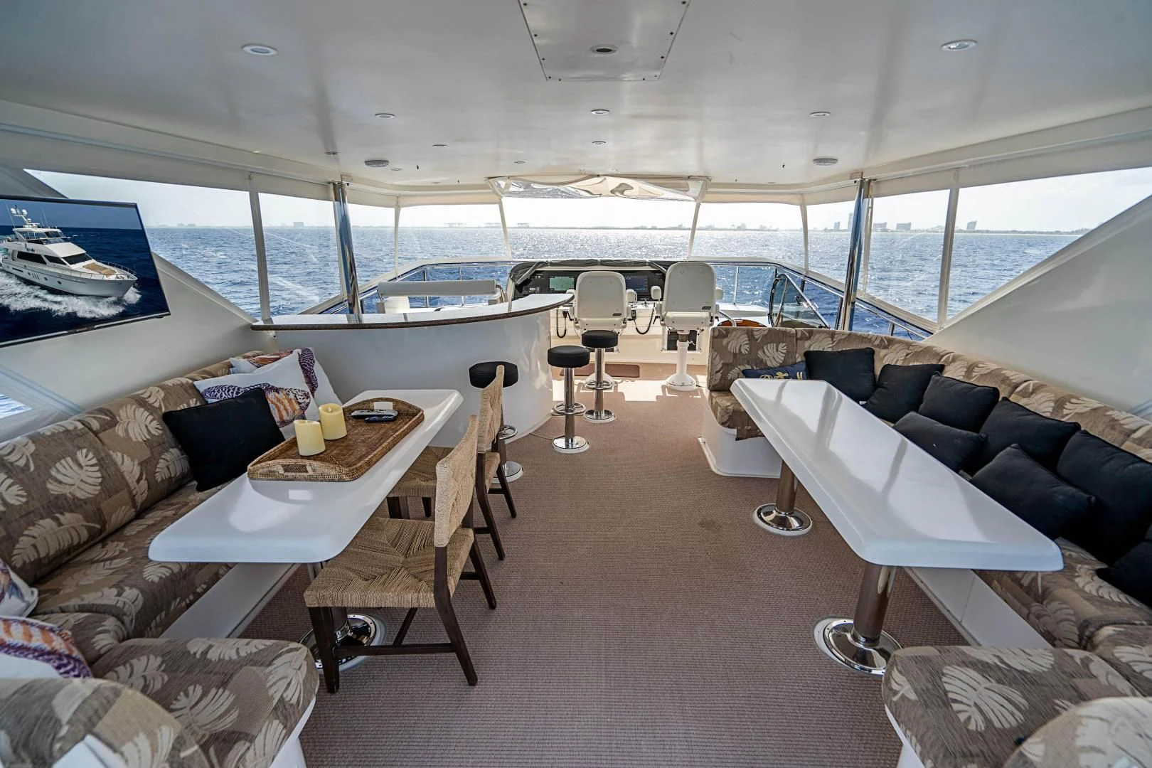 a living room with a large window aboard ROXY MARIA Yacht for Sale