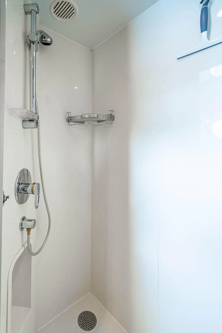 a white wall with a shower head aboard ROXY MARIA Yacht for Sale