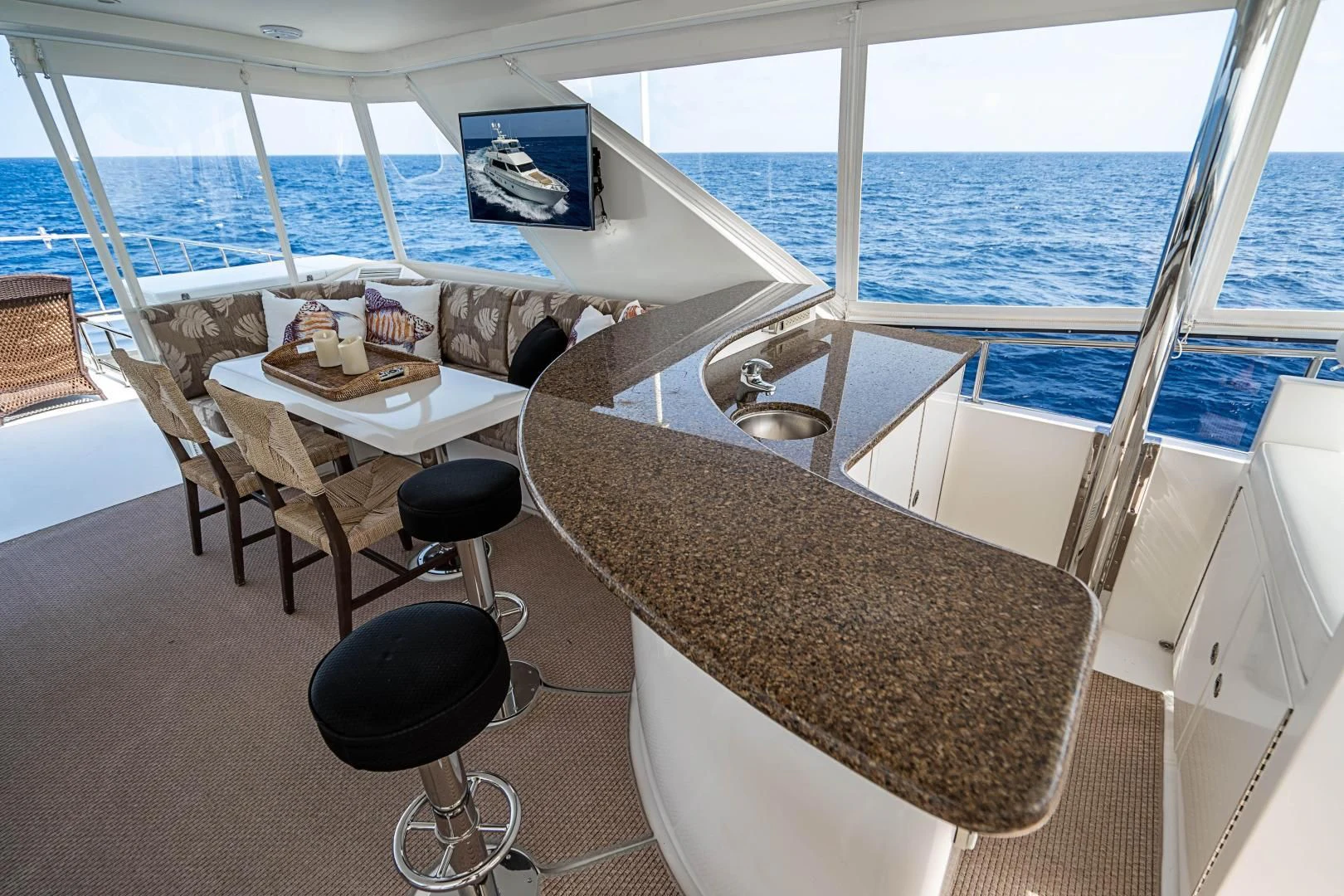 a room with a table and chairs aboard ROXY MARIA Yacht for Sale