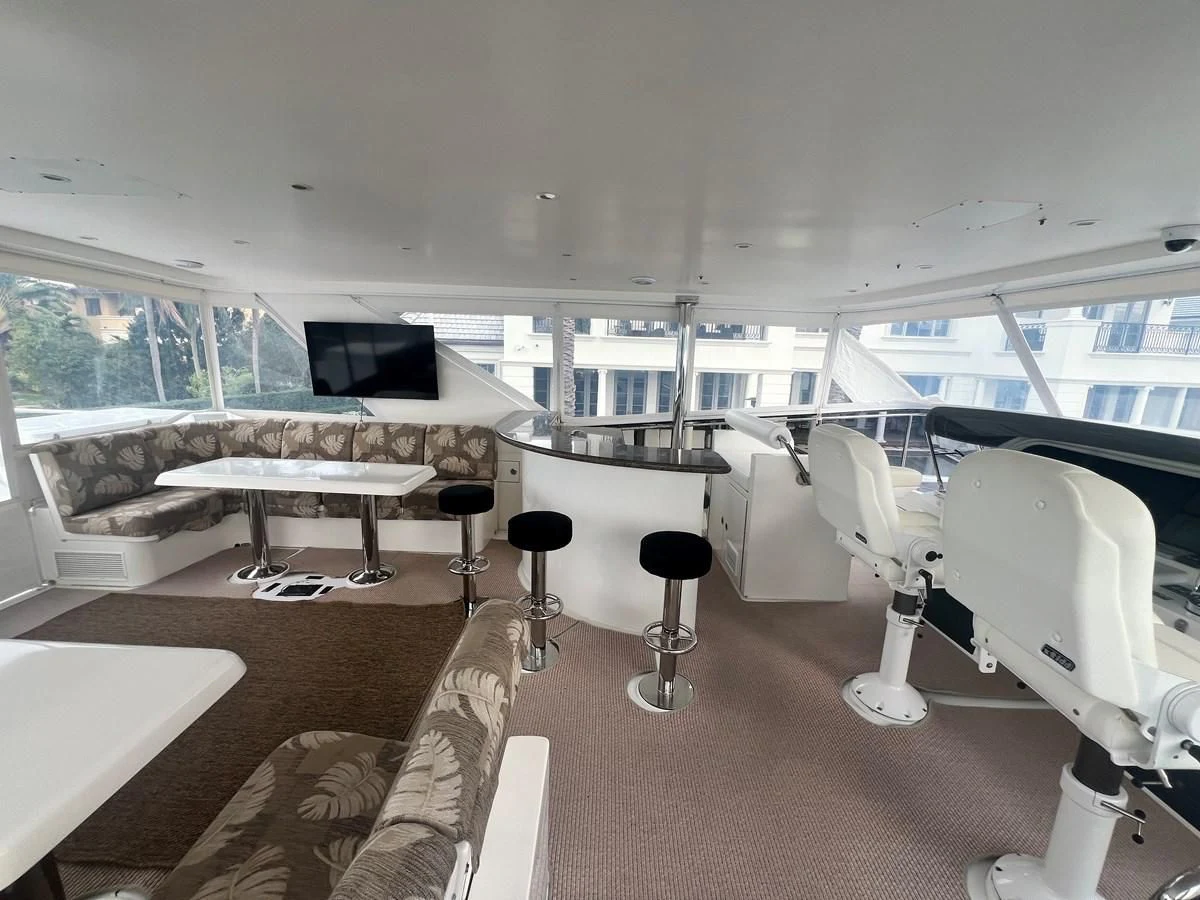 a room with a table and chairs aboard ROXY MARIA Yacht for Sale