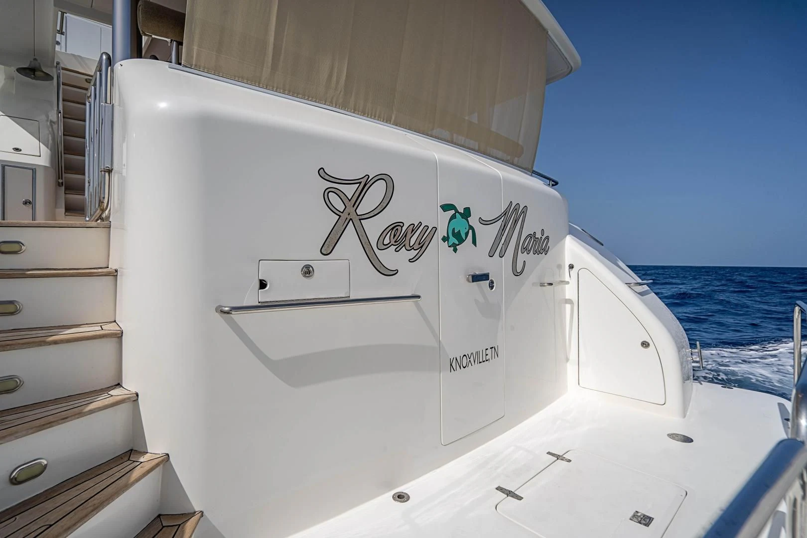 a white boat with a sign on the front aboard ROXY MARIA Yacht for Sale