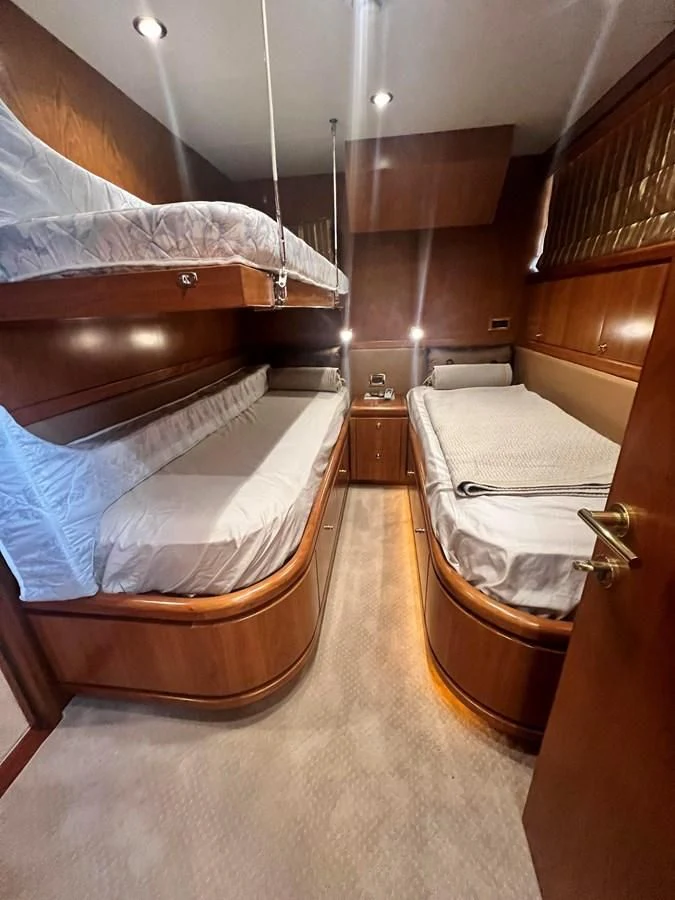 a bathroom with a bed and a sink aboard ROXY MARIA Yacht for Sale
