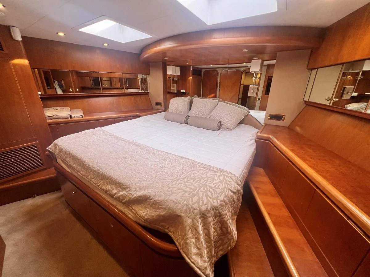 a room with a bed and a desk aboard ROXY MARIA Yacht for Sale