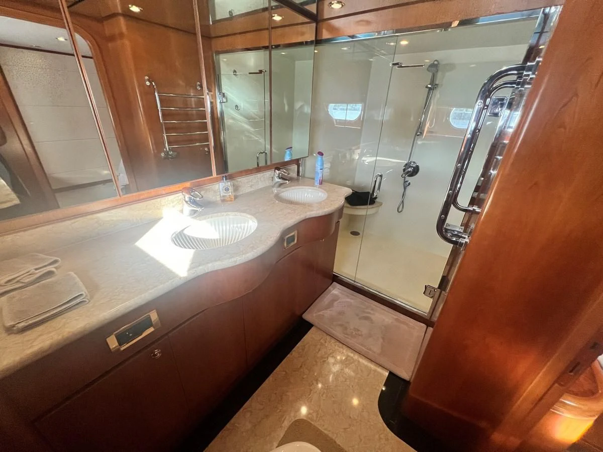 a bathroom with a glass shower aboard ROXY MARIA Yacht for Sale