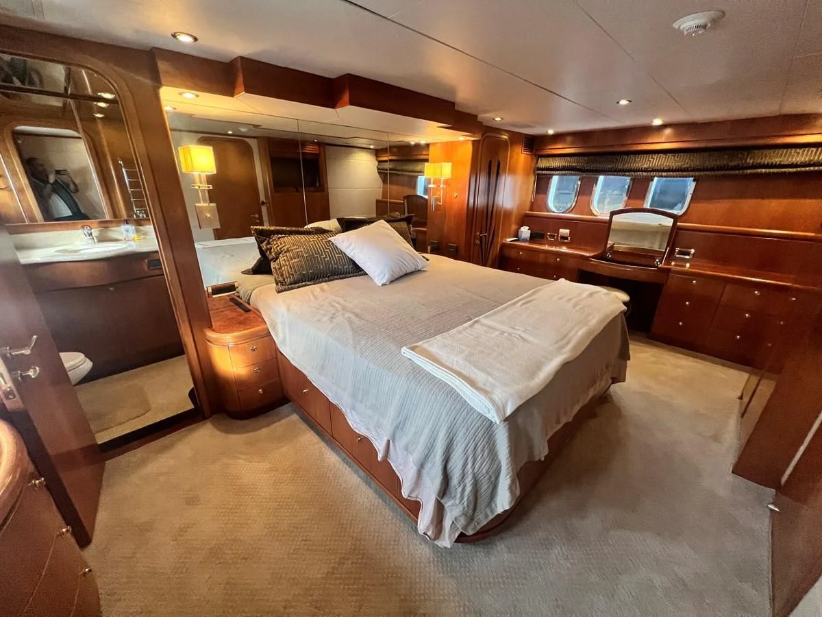 a large bedroom with a bed aboard ROXY MARIA Yacht for Sale