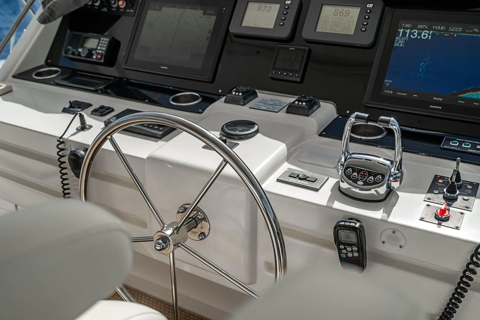 a white chair in front of a computer monitor and a phone aboard ROXY MARIA Yacht for Sale