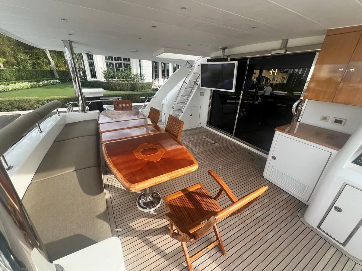 a living room with a couch and a tv aboard ROXY MARIA Yacht for Sale