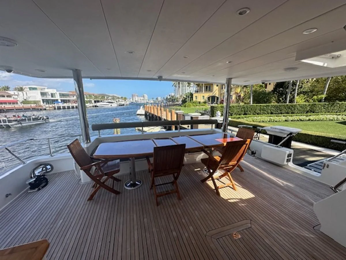 a table and chairs on a deck aboard ROXY MARIA Yacht for Sale