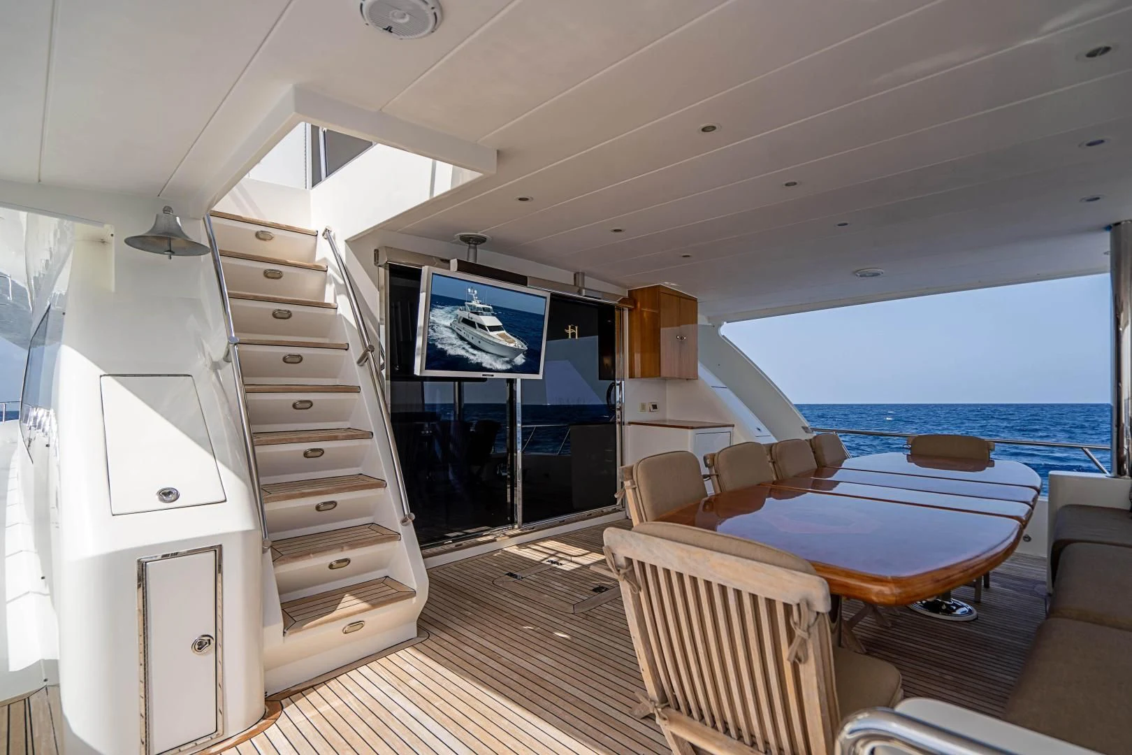 a room with a bed and a table and a television aboard ROXY MARIA Yacht for Sale