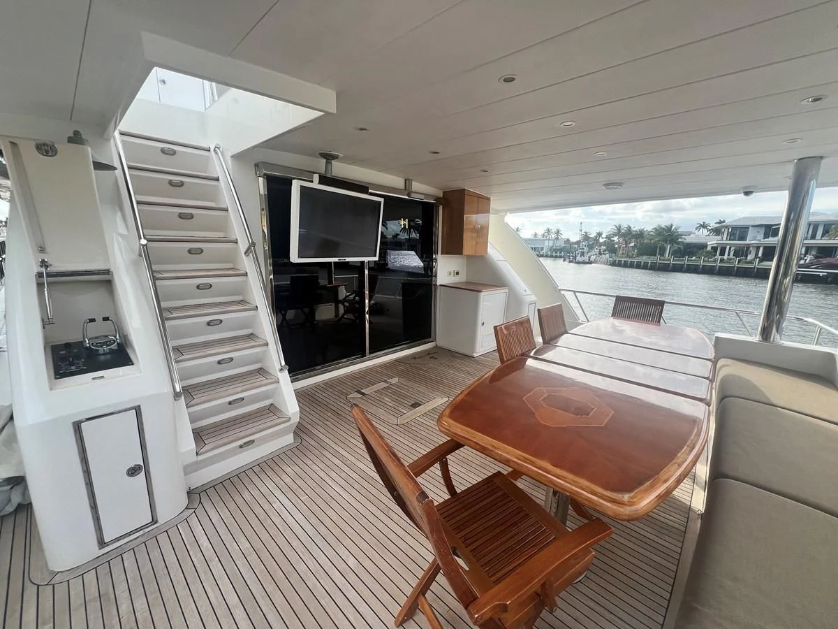 a room with a table and chairs aboard ROXY MARIA Yacht for Sale