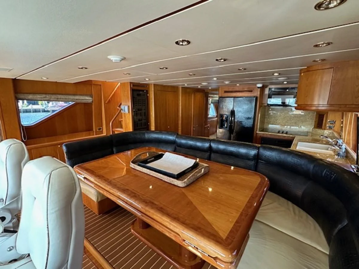 a wood table in a room aboard ROXY MARIA Yacht for Sale