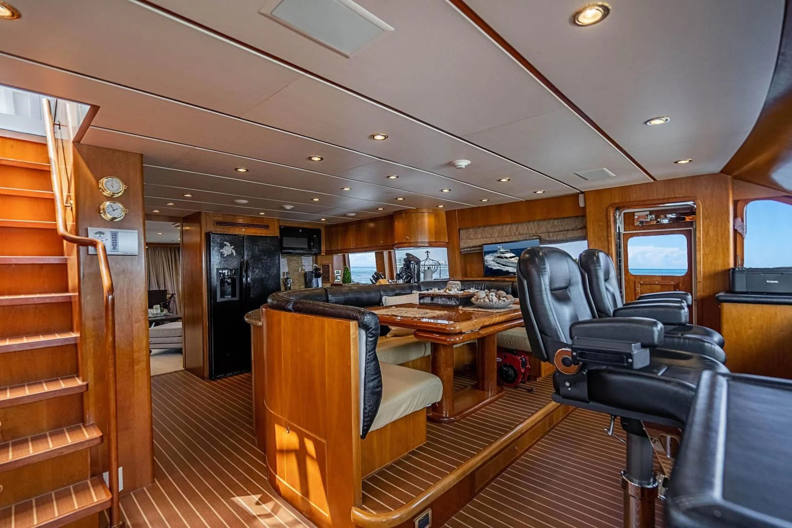 a room with a table and chairs aboard ROXY MARIA Yacht for Sale