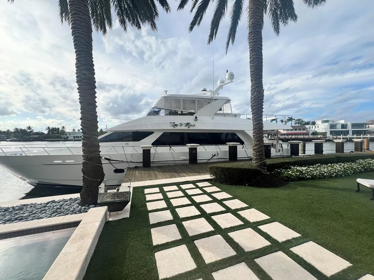 a white boat on a dock aboard ROXY MARIA Yacht for Sale