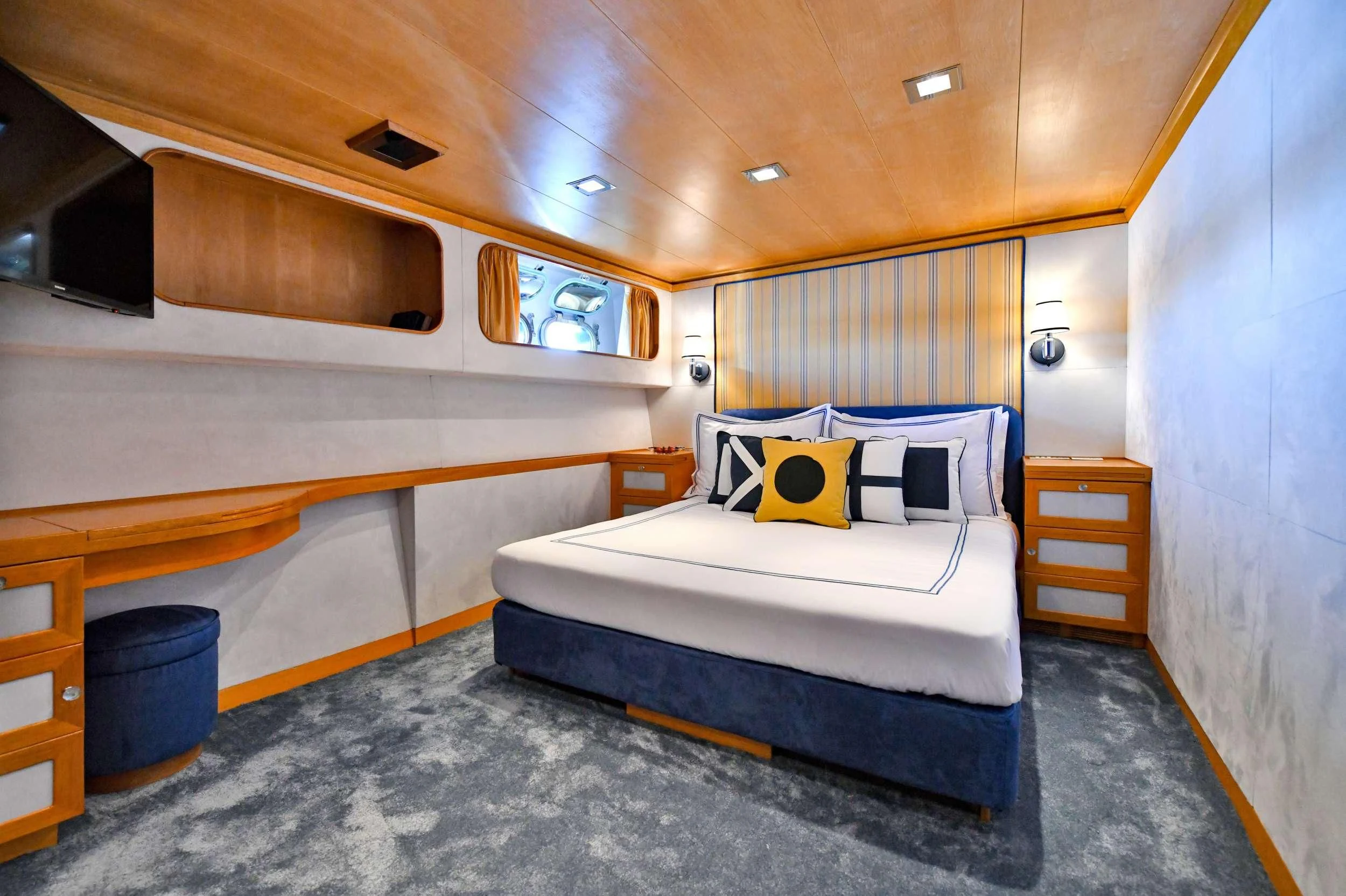 a bed in a room aboard SOMETHING COOL Yacht for Charter