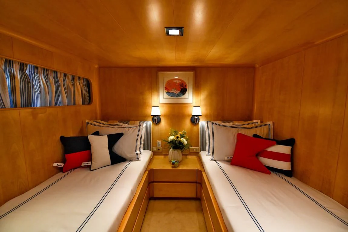 a room with two beds aboard SOMETHING COOL Yacht for Charter
