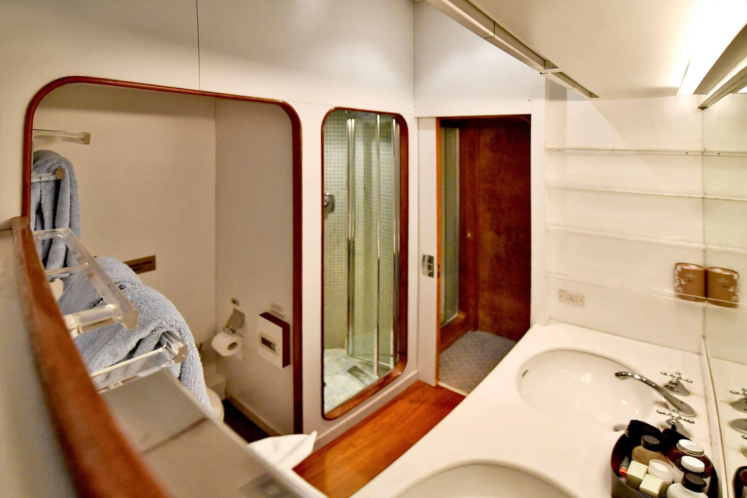 a bathroom with a tub and sink aboard SOMETHING COOL Yacht for Charter
