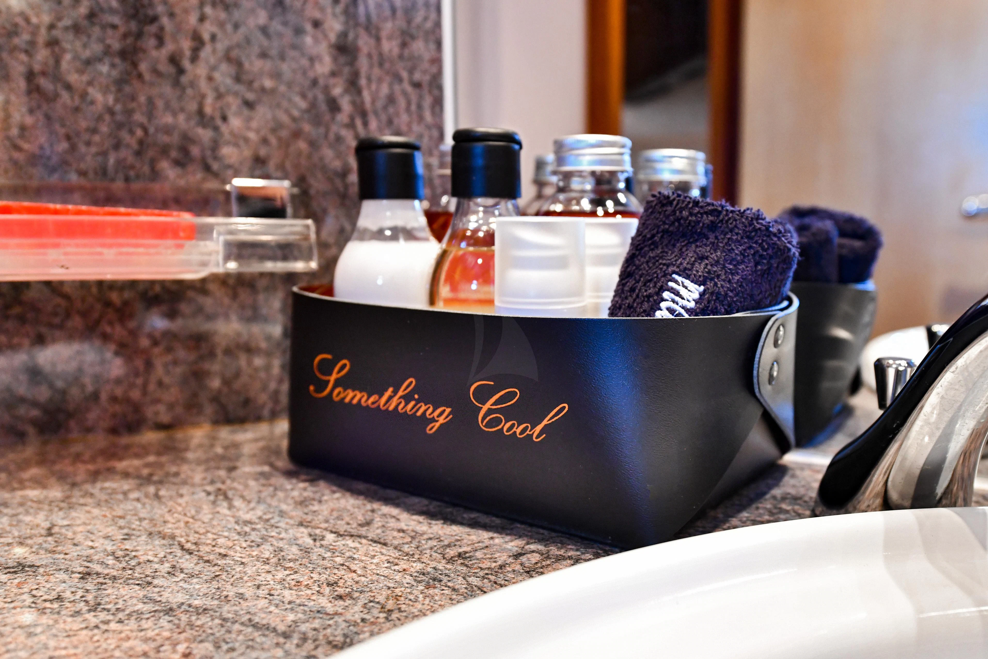 a bowl of purple and blue food items on a counter aboard SOMETHING COOL Yacht for Charter