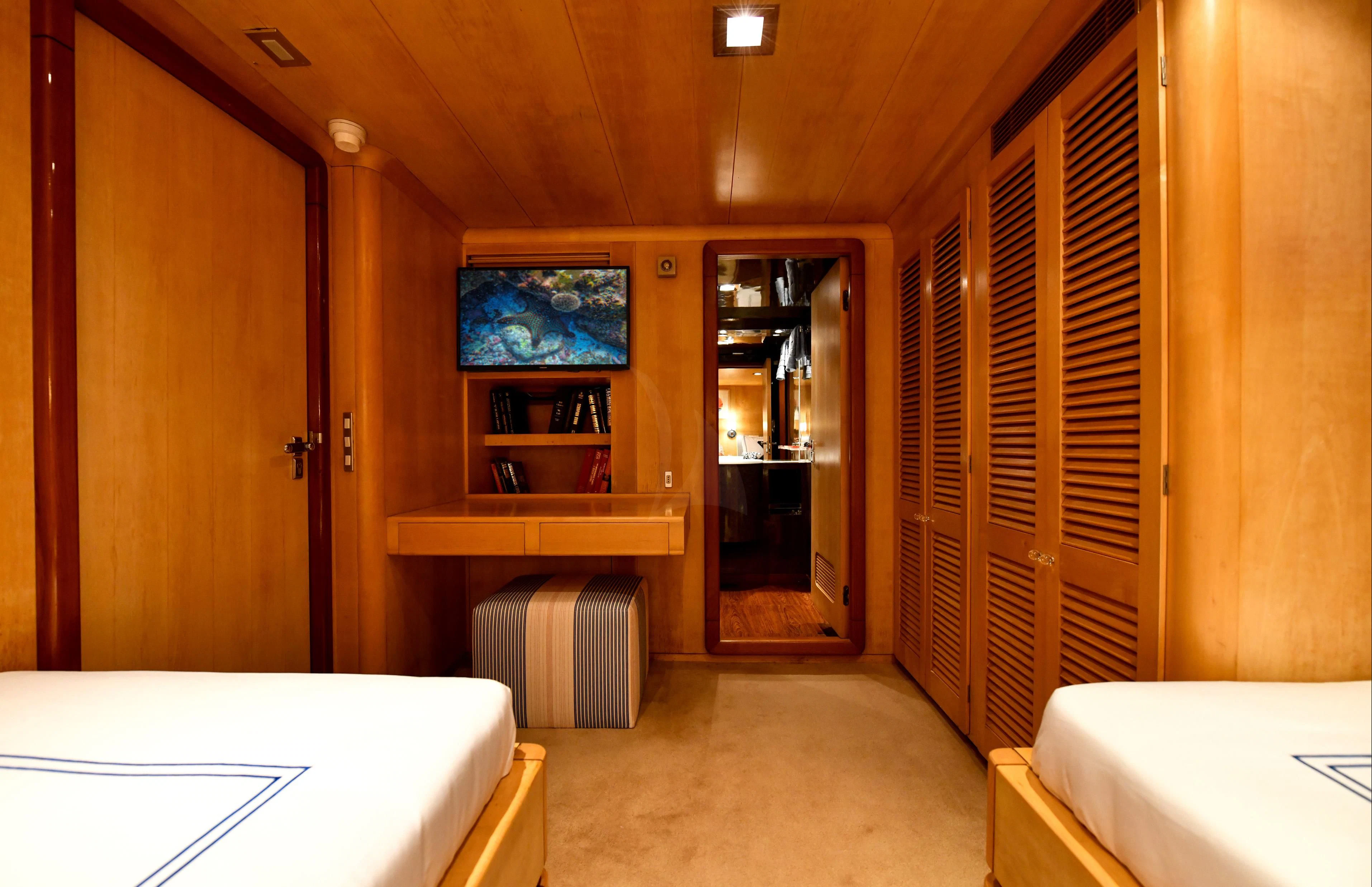 a room with a table and a window aboard SOMETHING COOL Yacht for Charter