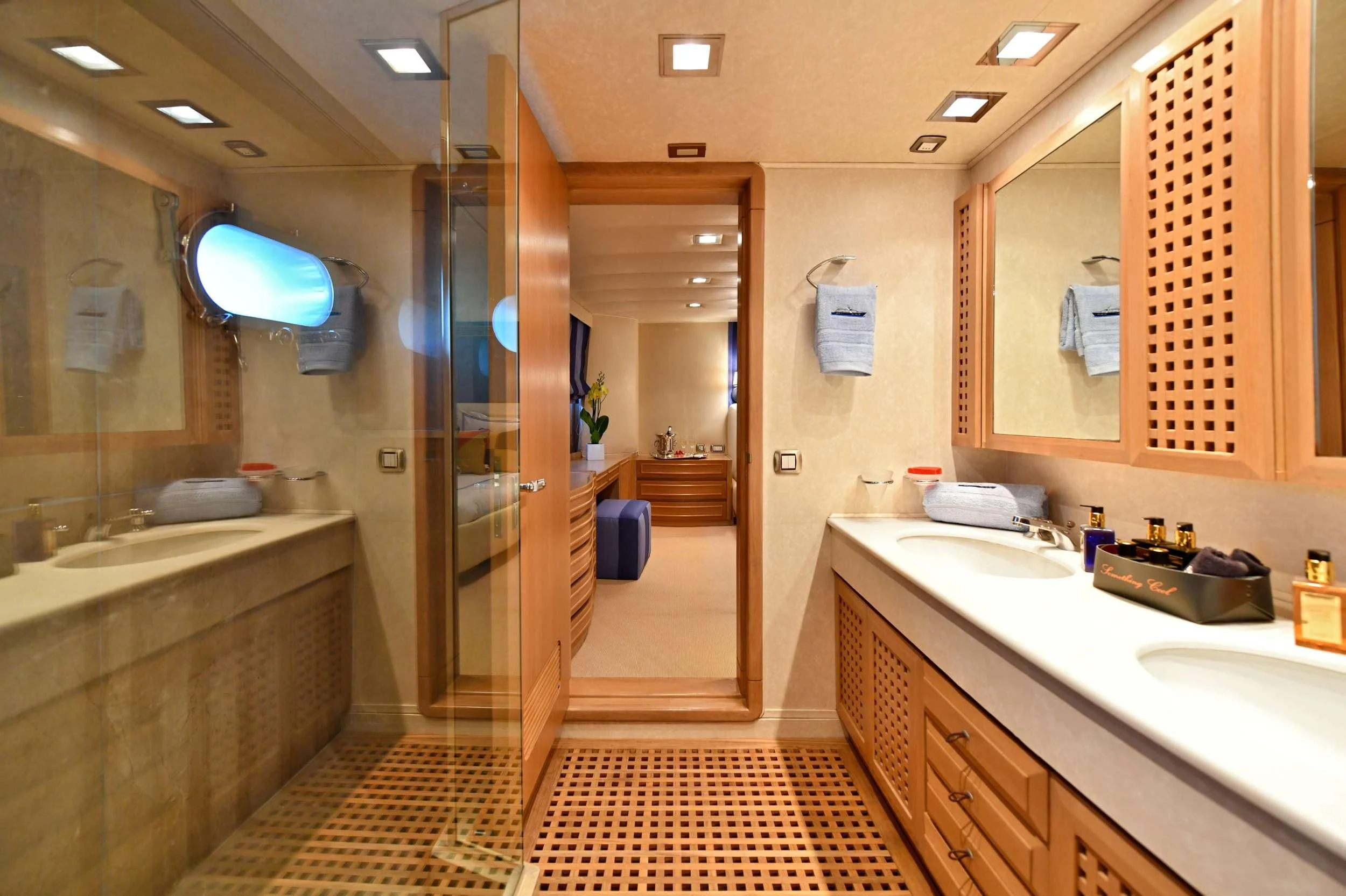 a bathroom with a large mirror aboard SOMETHING COOL Yacht for Charter