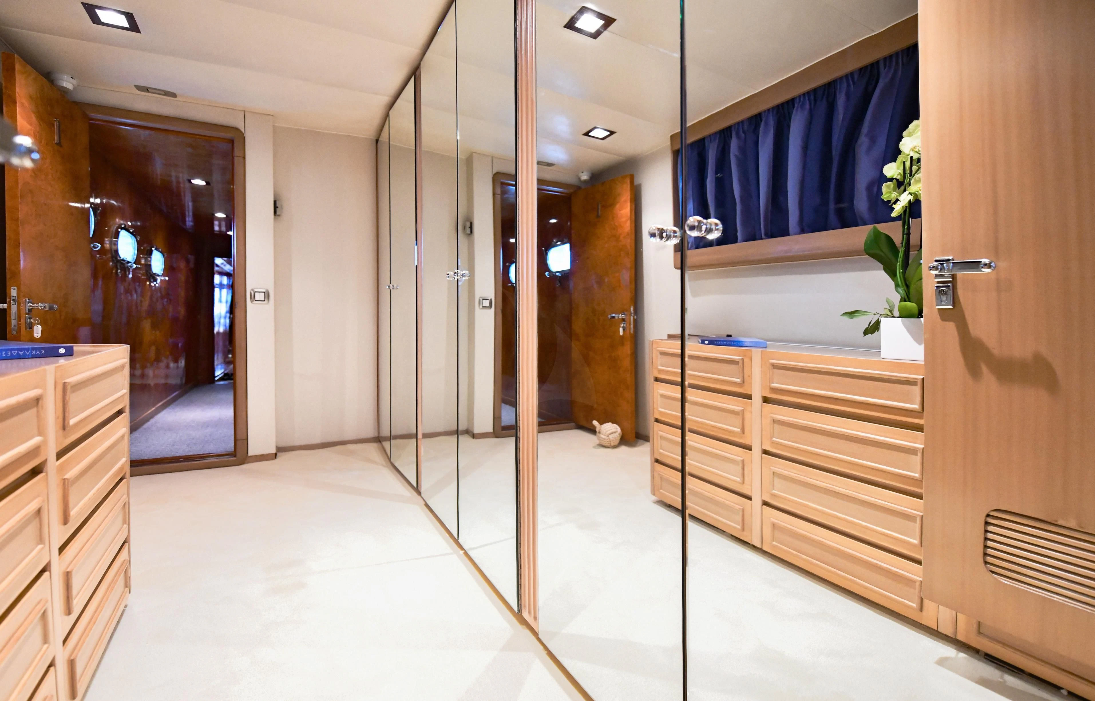 a room with a glass door and a glass wall with a glass window aboard SOMETHING COOL Yacht for Charter