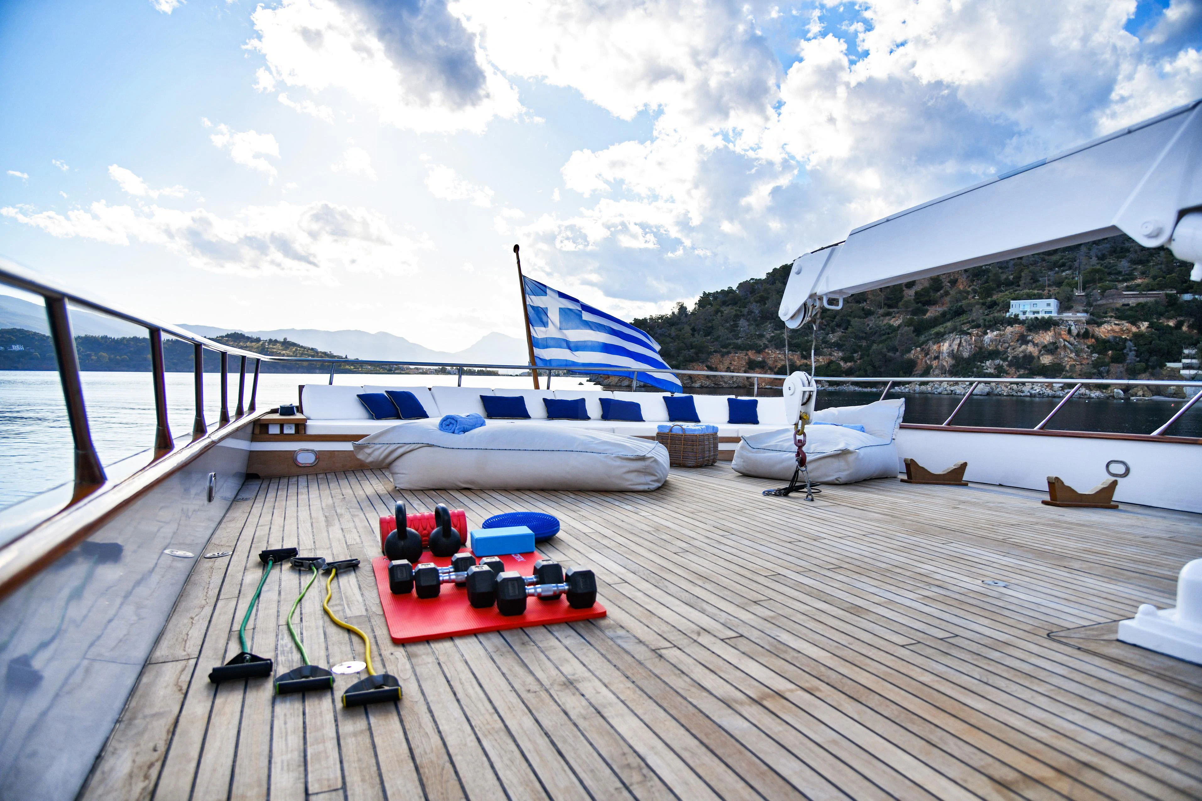 a boat on a dock aboard SOMETHING COOL Yacht for Charter