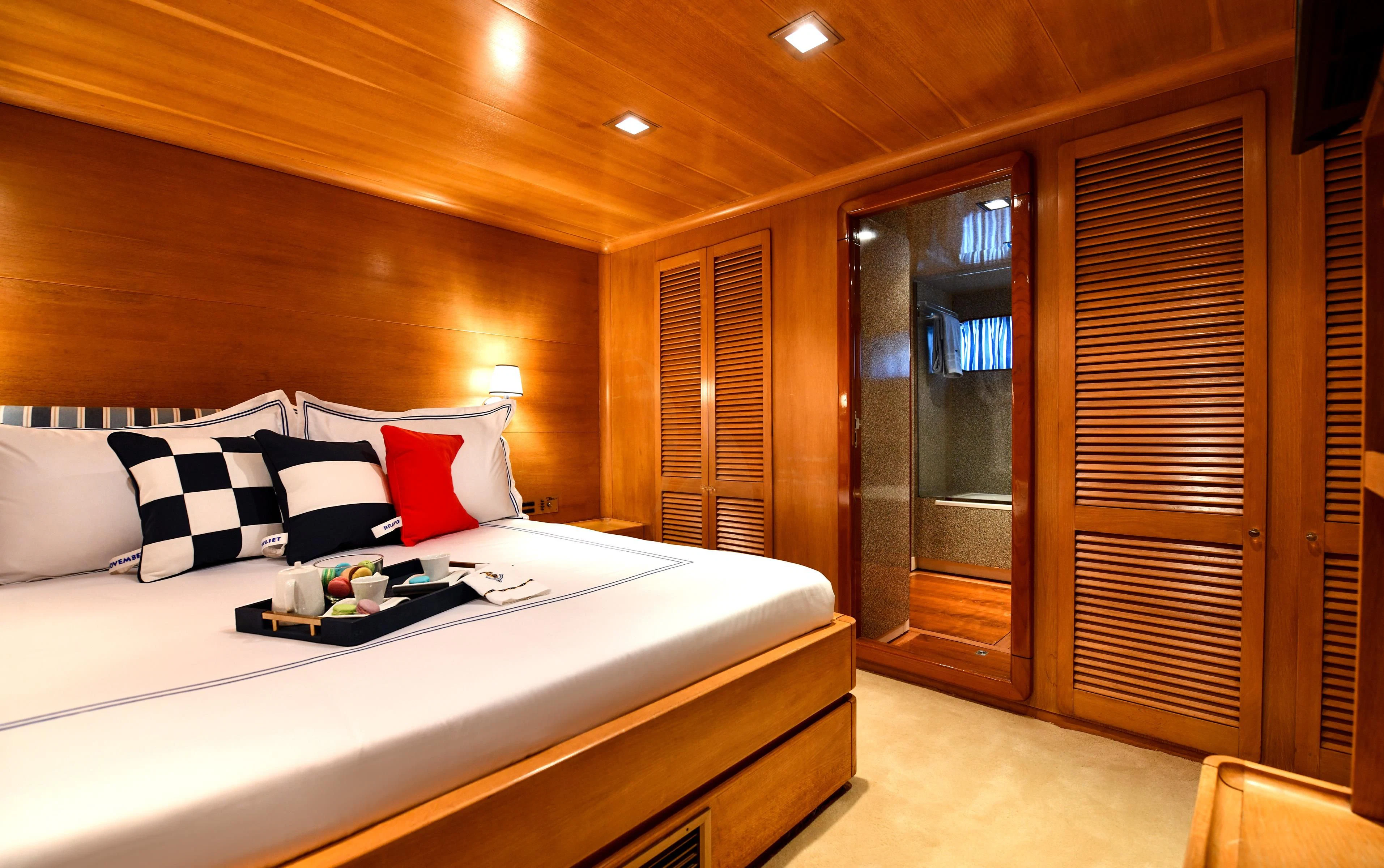 a bed in a room aboard SOMETHING COOL Yacht for Charter