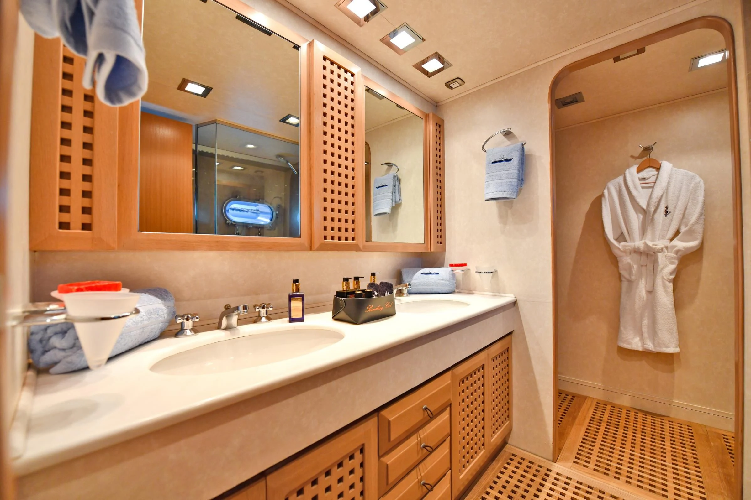 a bathroom with a large mirror aboard SOMETHING COOL Yacht for Charter