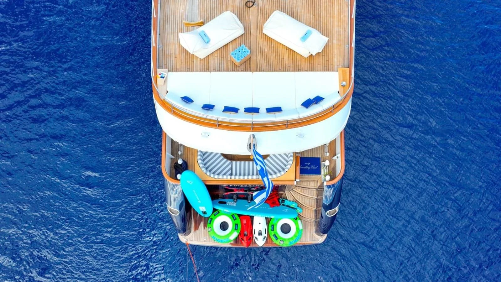 a toy airplane on a blue surface aboard SOMETHING COOL Yacht for Charter