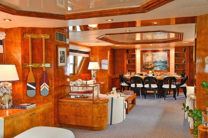 a room with a table and chairs aboard SOMETHING COOL Yacht for Charter