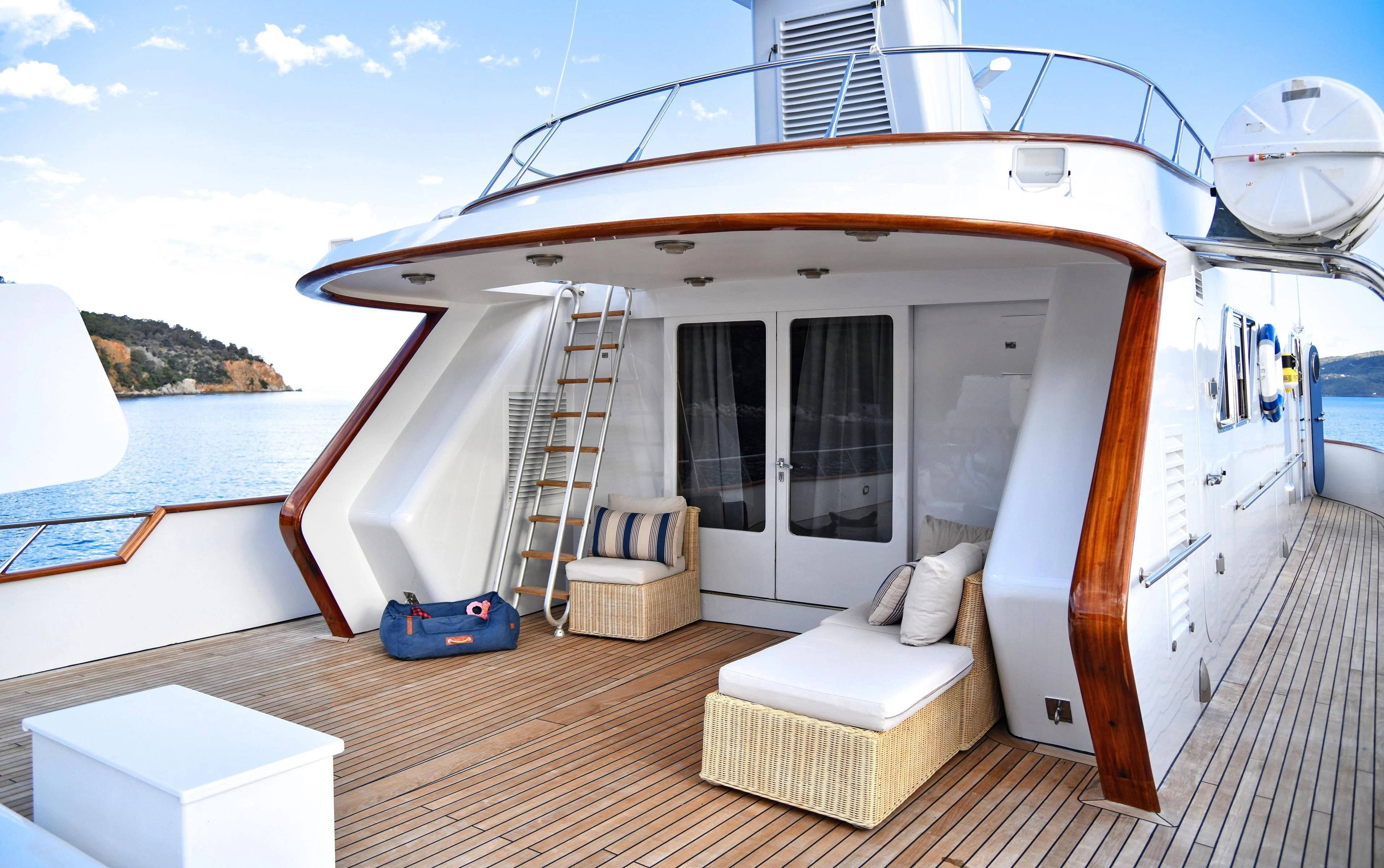 a boat on a deck aboard SOMETHING COOL Yacht for Charter