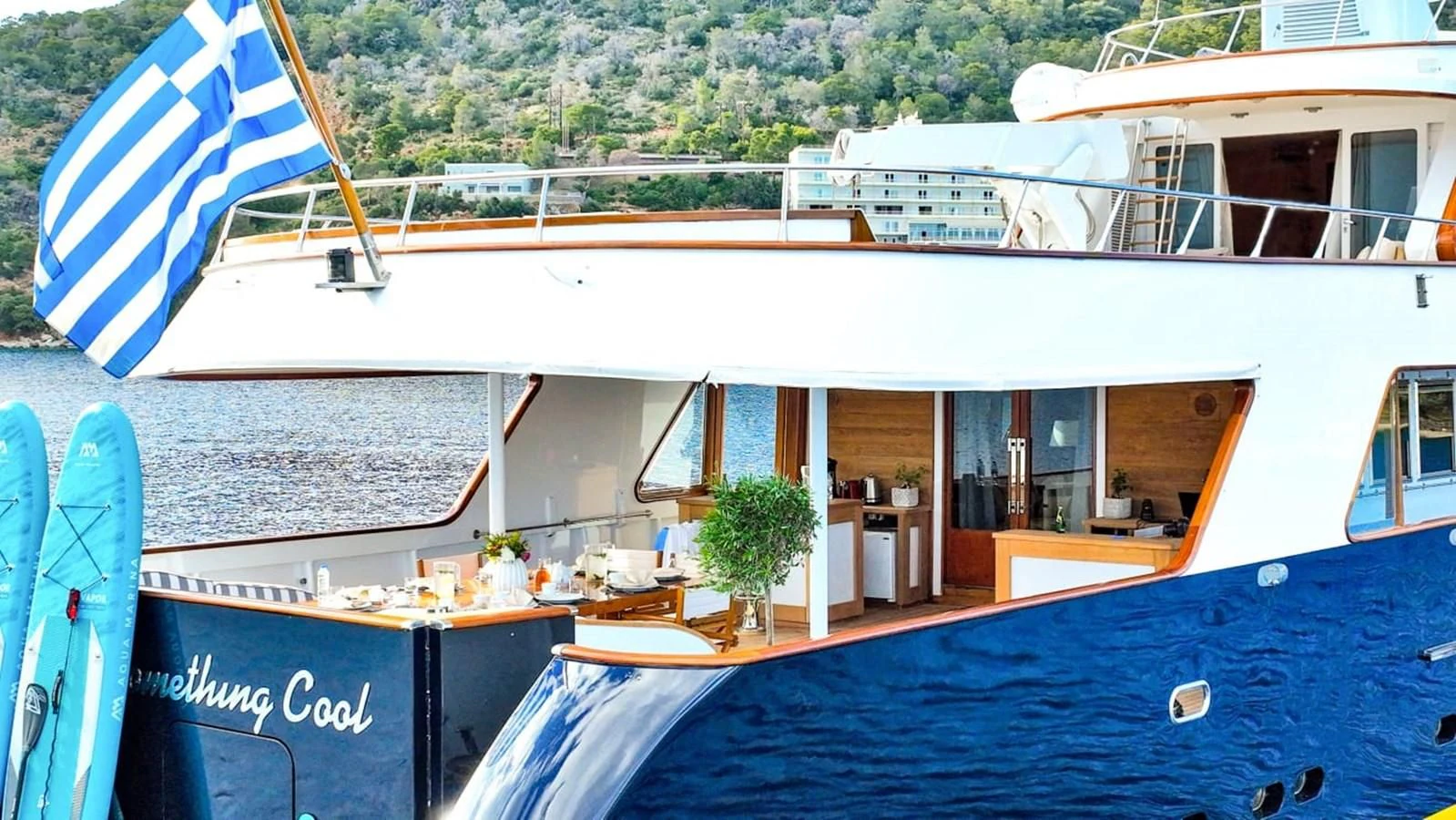a swimming pool outside a building aboard SOMETHING COOL Yacht for Charter