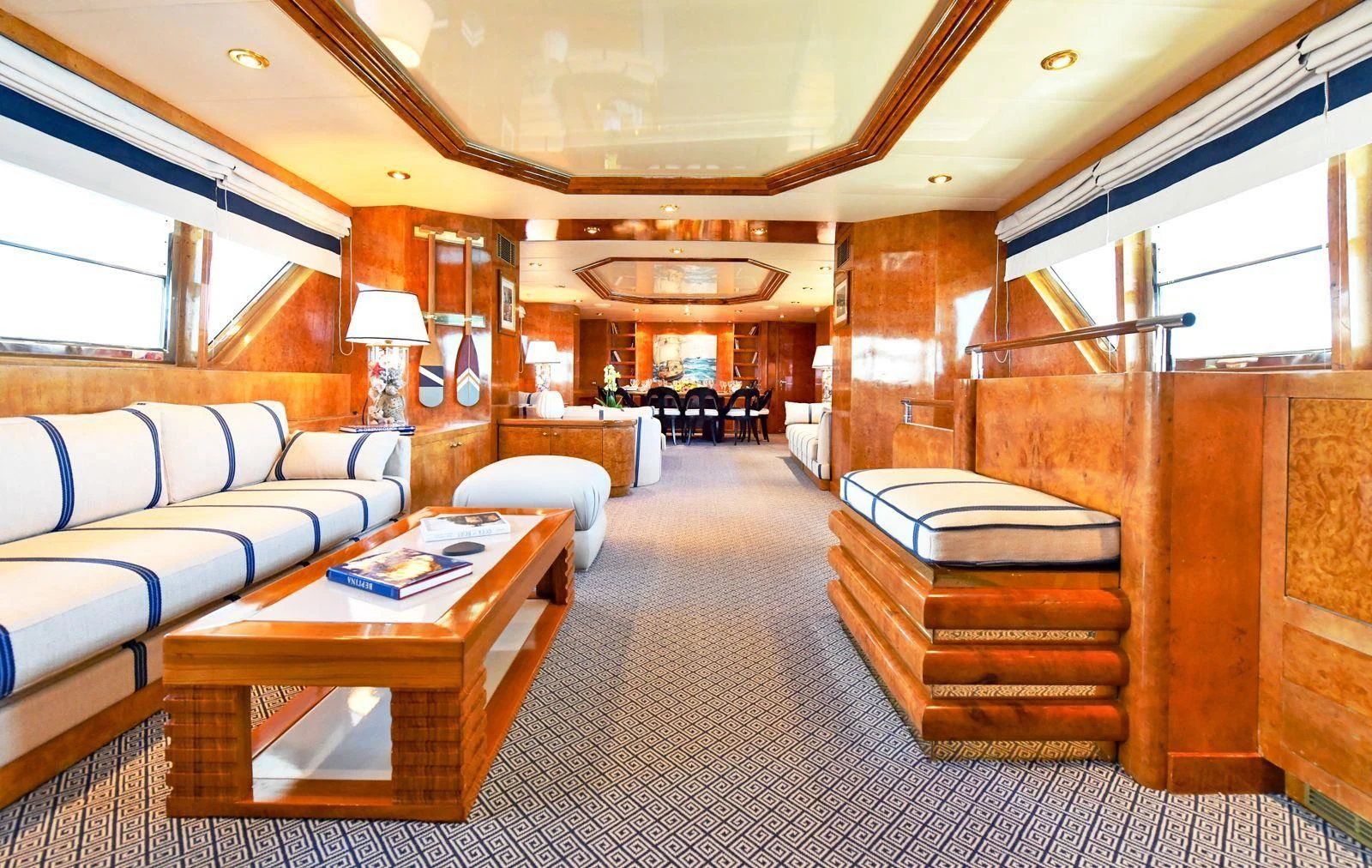 a room with a couch and a table aboard SOMETHING COOL Yacht for Charter