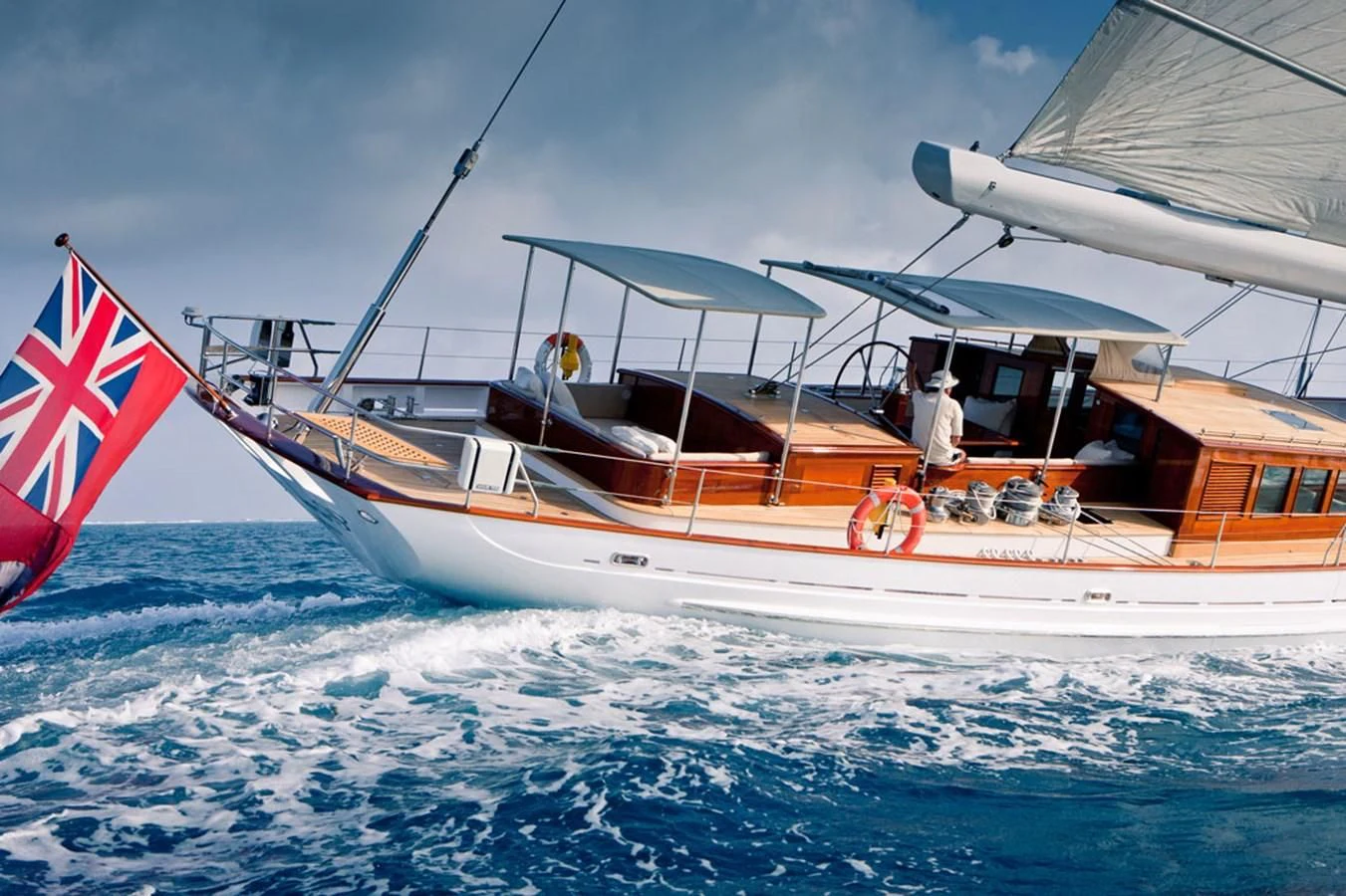 a boat with a flag on it aboard URIEL Yacht for Sale