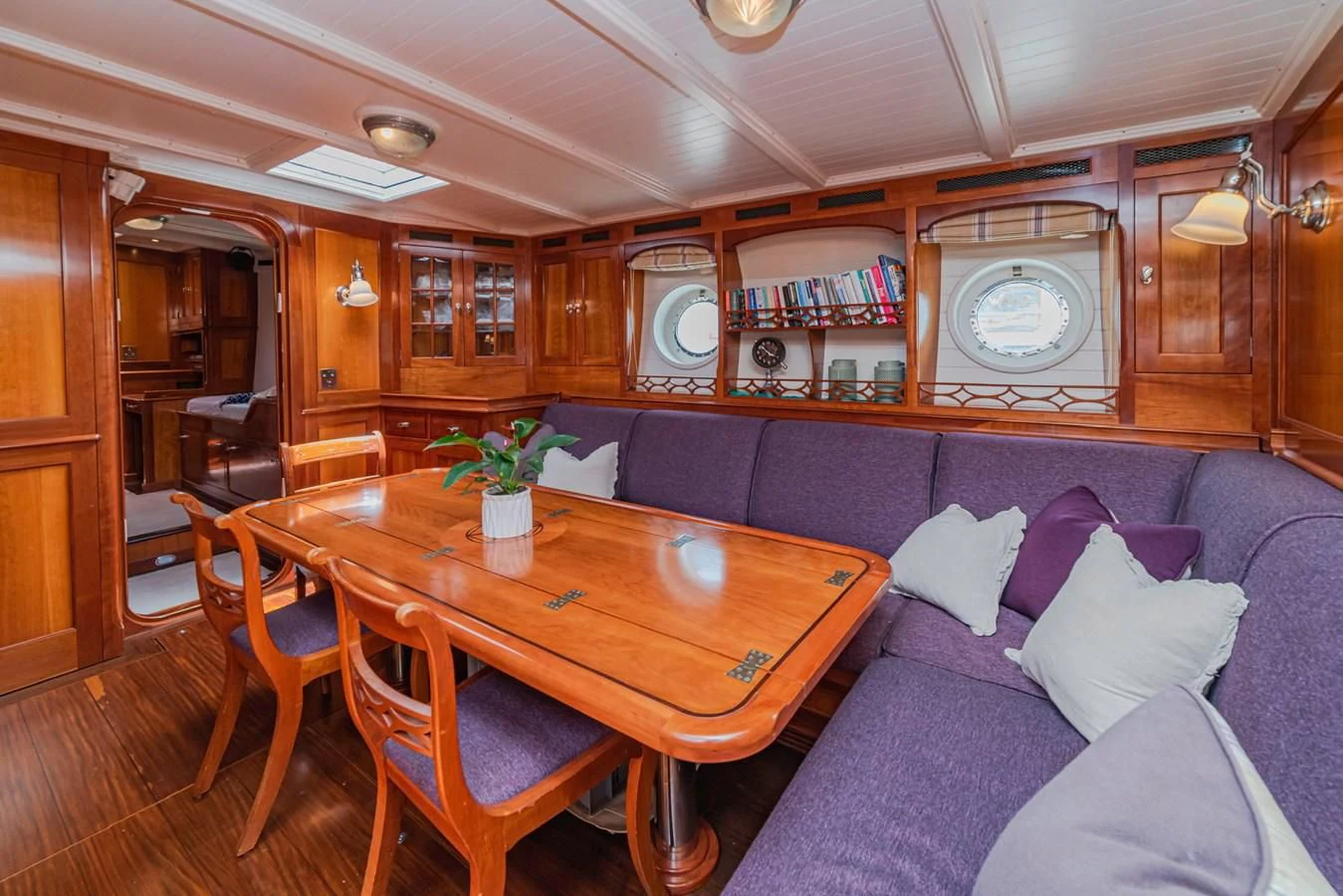 a living room with a couch and a table aboard URIEL Yacht for Sale