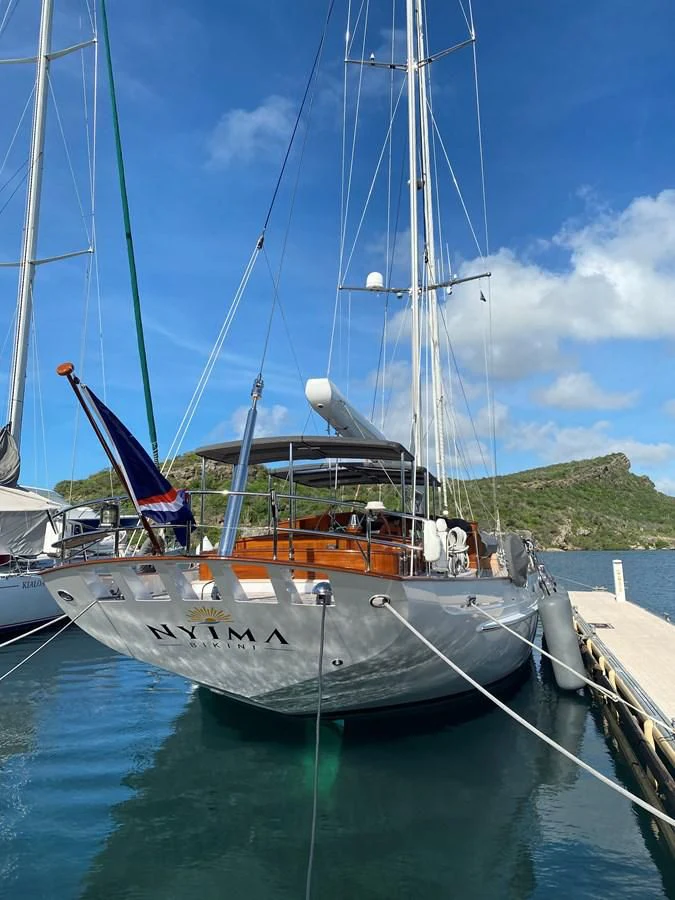 a boat docked at a pier aboard URIEL Yacht for Sale