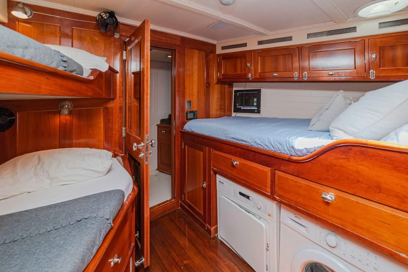 a room with wooden furniture aboard URIEL Yacht for Sale